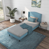 a bed with a blue kids mattress in a room