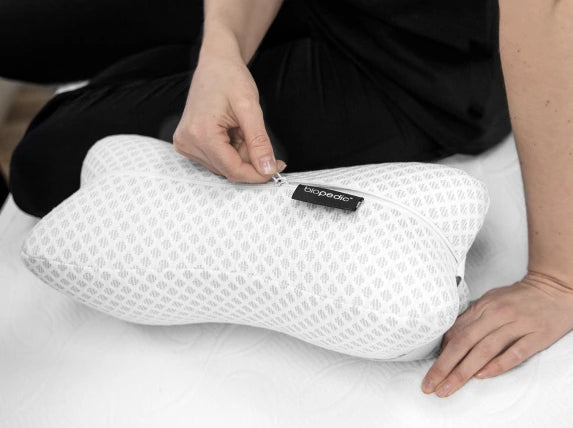 https://www.napqueensleep.com/cdn/shop/files/Supportive_Memory_Foam_Bone_Shaped_Pillow_with_Adjustable_Strap_Carousel_Image_4.webp?v=1699559919