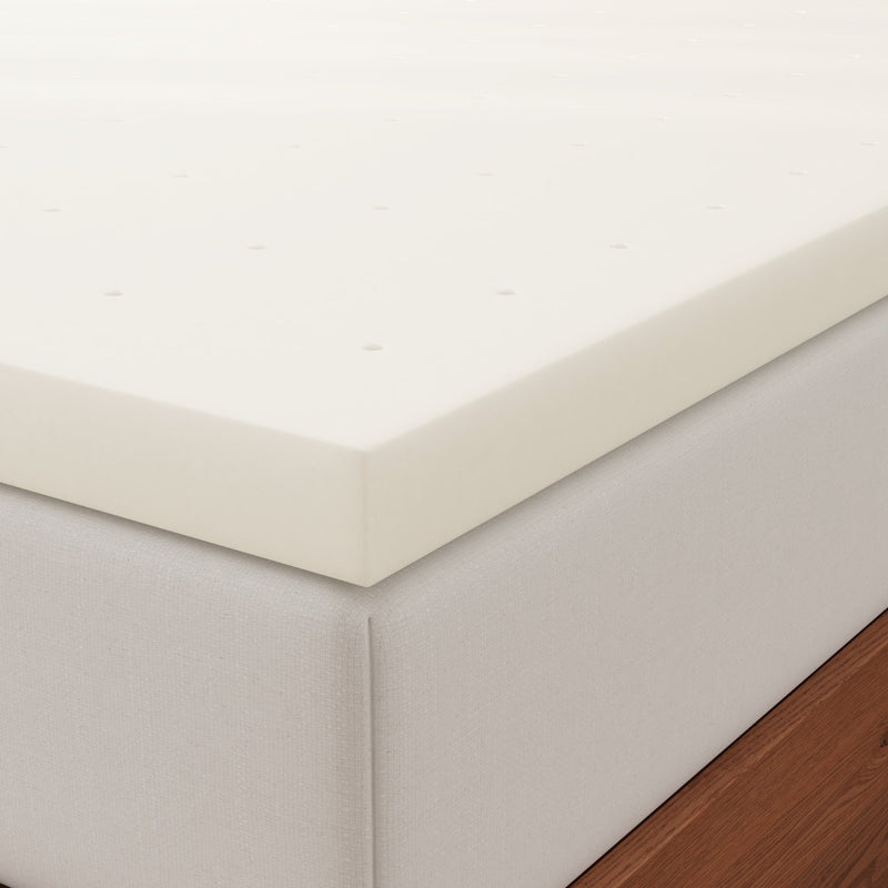 a mattress topper with a white foam pad