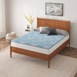 a bed with a blue mattress topper